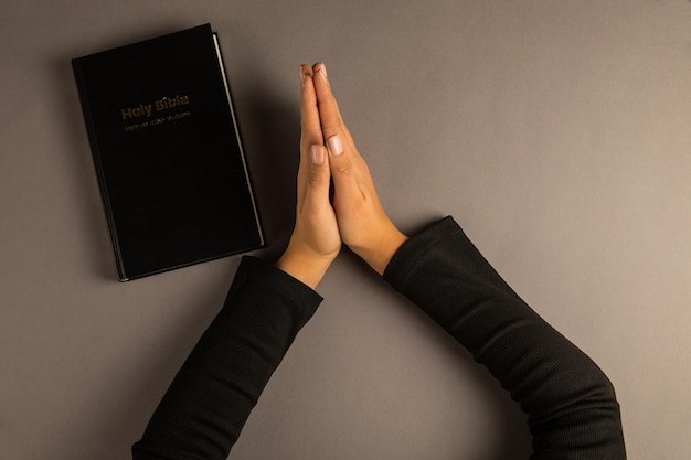 Woman praying with her arms crossed