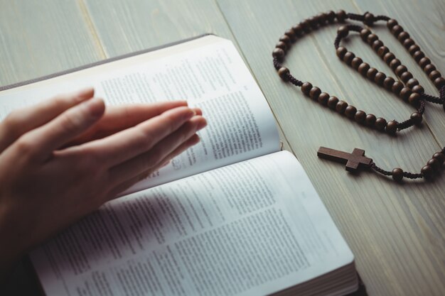 Woman praying with her bible