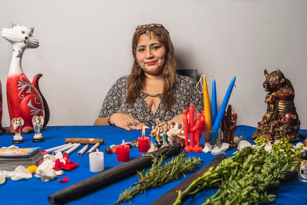 Woman preparing candles and cards to practice palmistry