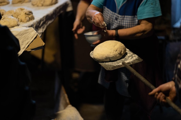 Woman preparing and cutting bread