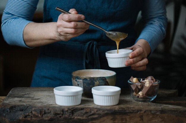 Woman preparing dessert, partial view