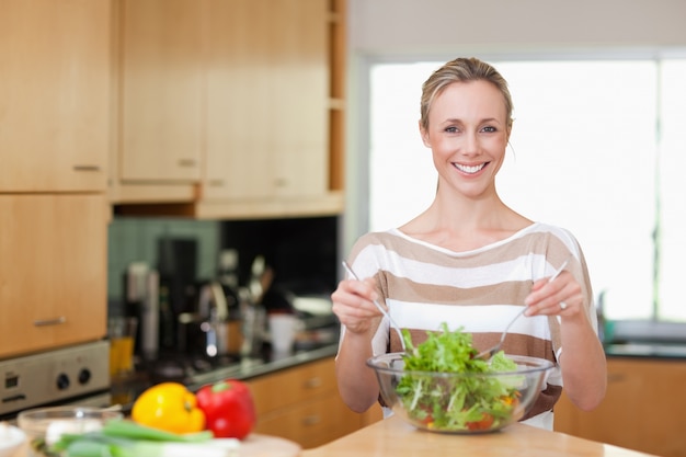 Woman preparing healthy salad