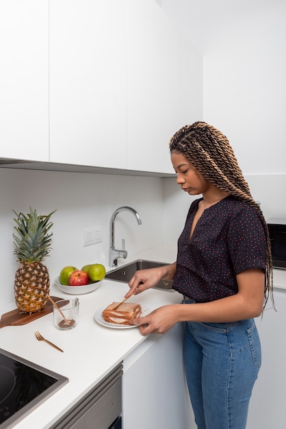 woman preparing healthy sandwiches for breakfast