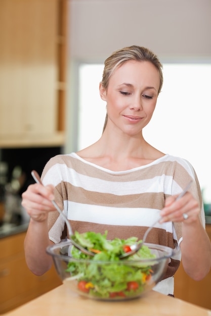 Woman preparing salad