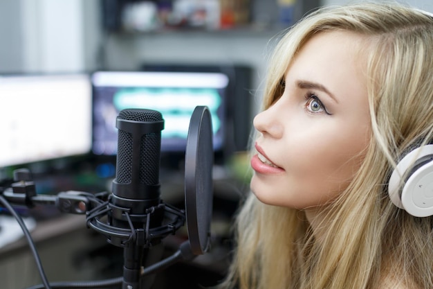 woman preparing to sing in recording studio