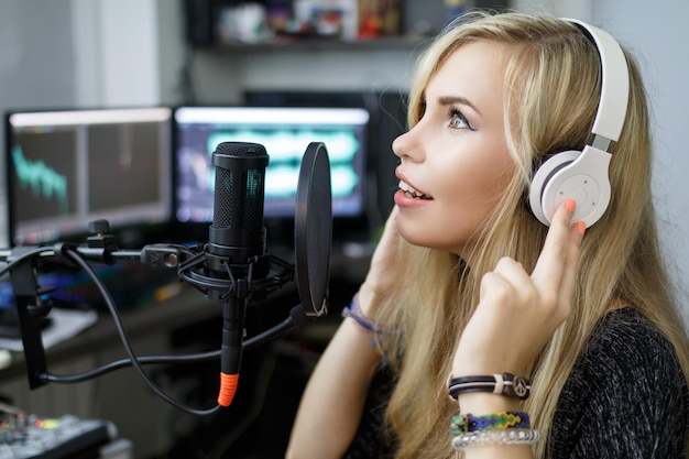 woman preparing to sing in recording studio