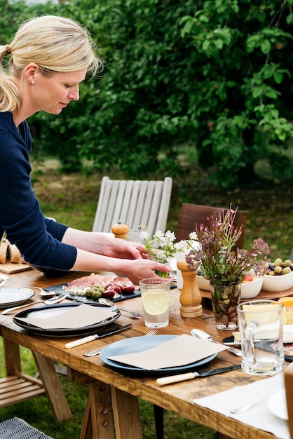 Woman Preparing Table Dinner Concept