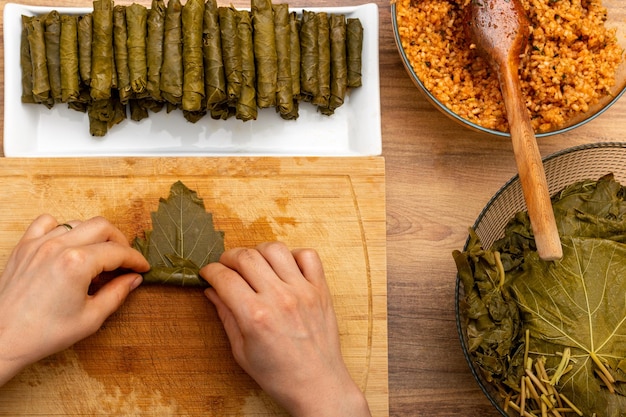 woman preparing turkish sarma in kitchen