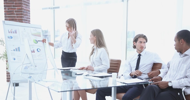 Woman presenting her idea to colleagues at meeting