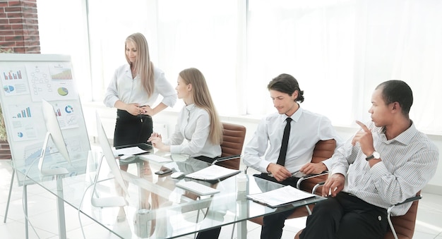 Woman presenting her idea to colleagues at meeting