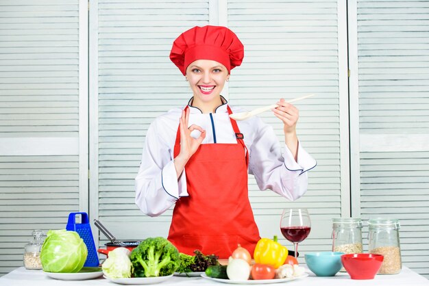 Woman professional chef hold spoon Dieting concept Healthy vegetarian and vegan recipes Eat healthy Woman chef cooking hold wooden spoon Healthy recipes Try delicious meal Healthy ration