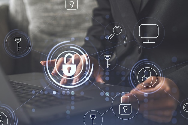 A woman programmer is typing a code on computer to protect a\
cyber security from hacker attacks and save clients confidential\
data padlock hologram icons over the typing hands formal wear