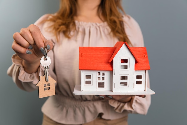 Woman for property with a house and a key