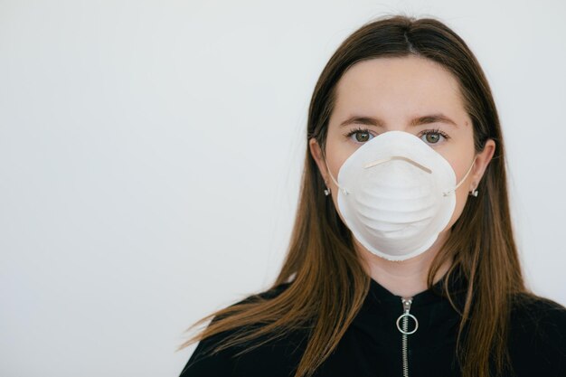 Woman in protective mask with grey case