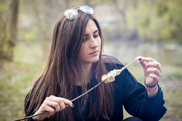 Woman pulls marshmallows