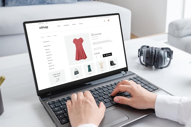 Woman purchasing a stunning red dress online with laptop computer Modern ecommerce web page interface