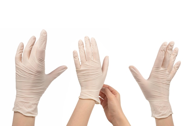 Woman puts on white rubber gloves Isolated on white