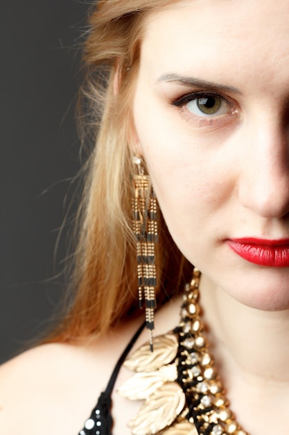 Woman putting on diamond earrings Caucasian beauty lady trying and shopping jewelry