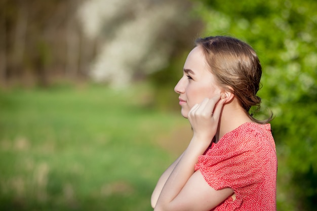 Woman putting hearing aid in ears