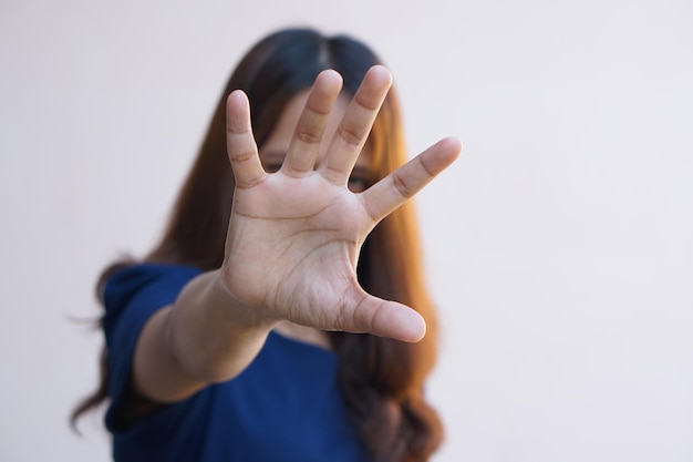 Woman raised her hand for dissuade campaign stop violence against women