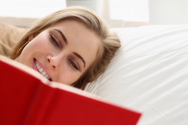 woman read book stay in bed