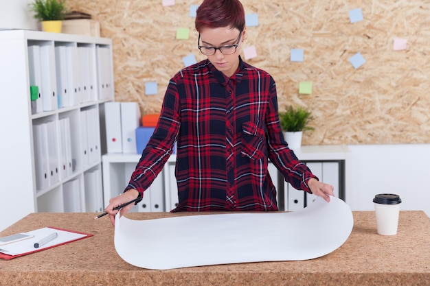 Woman reading blueprint