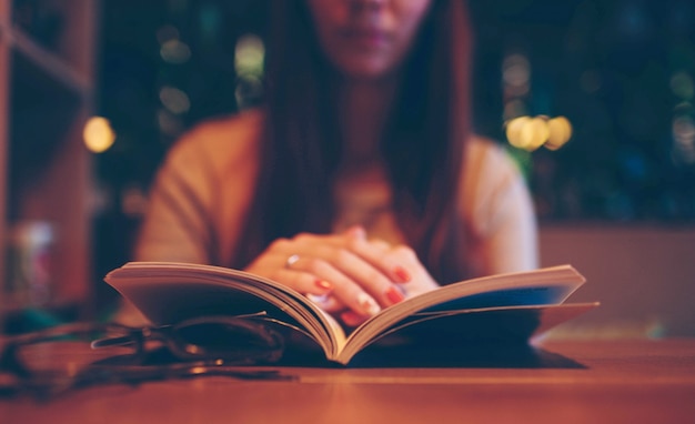 Woman reading a book in a cafe!