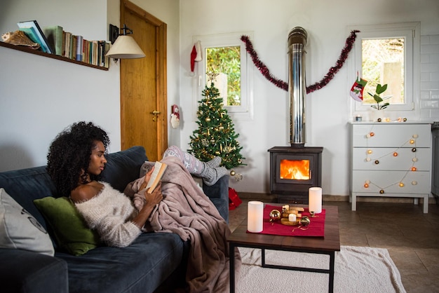 Woman reading book in cozy room