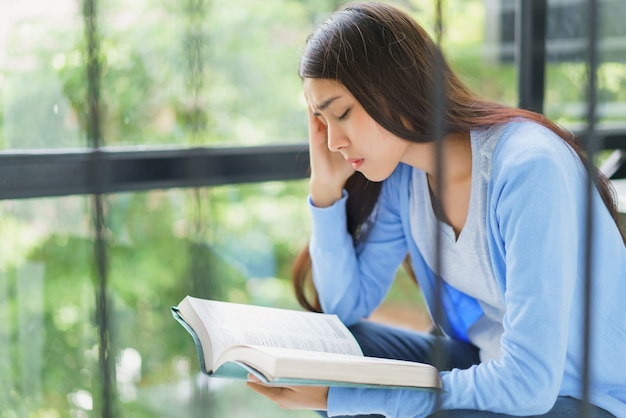 Woman reading book.