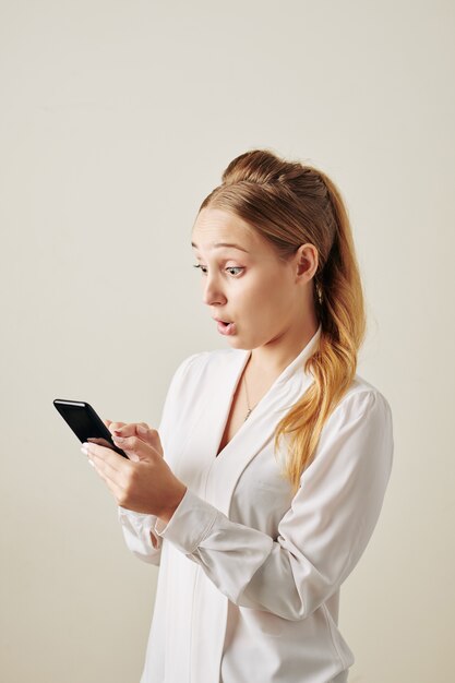 Woman reading exciting news