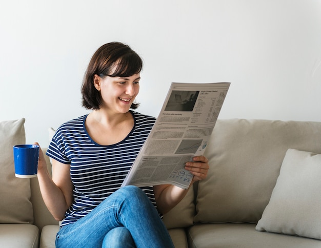 Woman reading newspaper