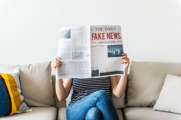 Woman reading newspaper