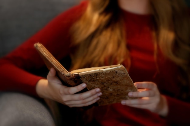 Woman reading old book