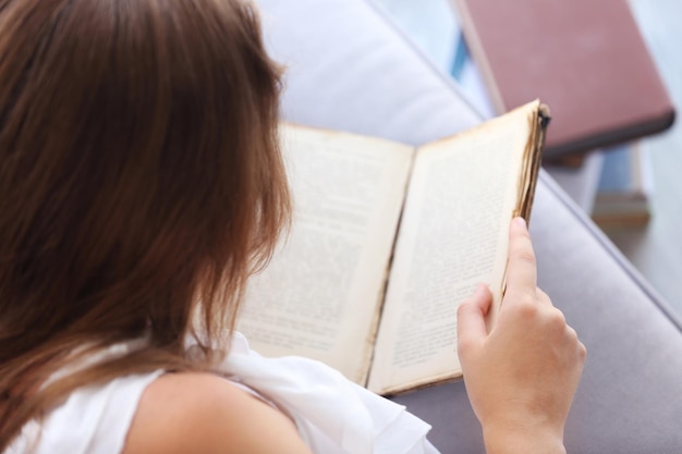 Woman reading old book