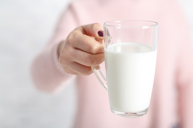 Woman ready to drink a mug of milk