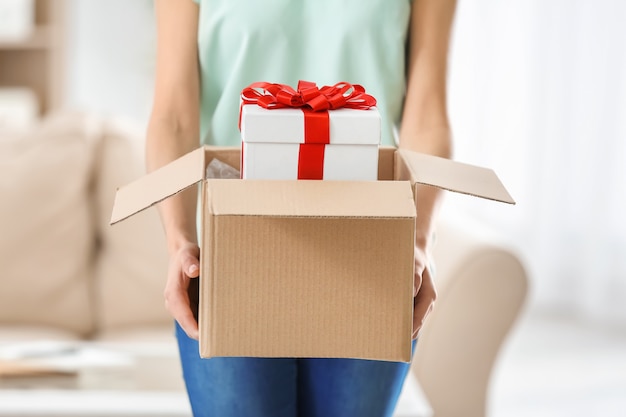 Woman received gift in parcel box at home