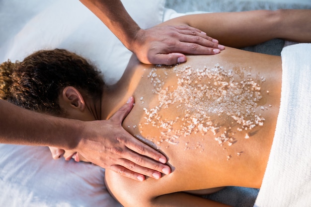 Woman receiving back massage from physiotherapist