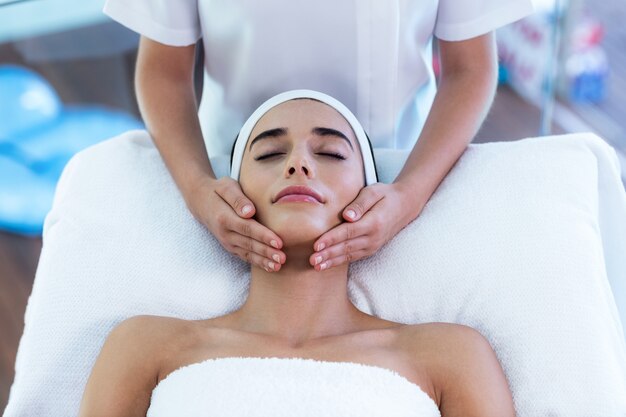 Woman receiving a face massage