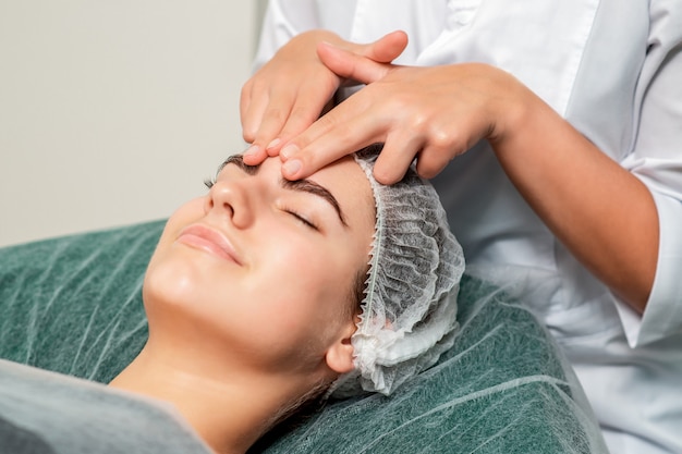 Woman receiving face massage.