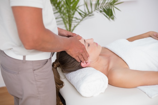 Woman receiving head massage 