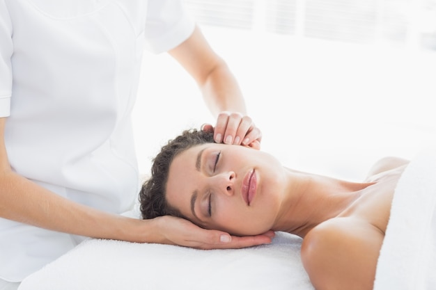 Woman receiving head massage