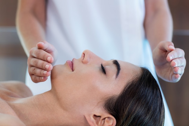 Woman receiving massage from masseur