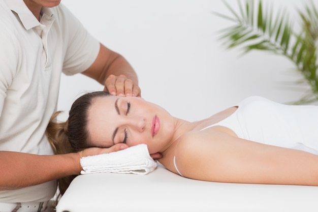 Woman receiving neck massage 