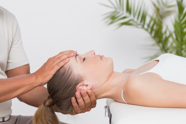 Woman receiving neck massage 