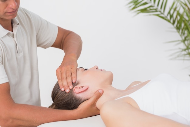 Woman receiving neck massage 