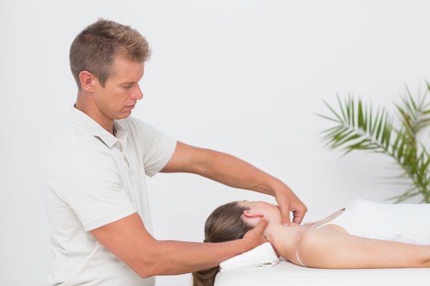 Woman receiving neck massage 