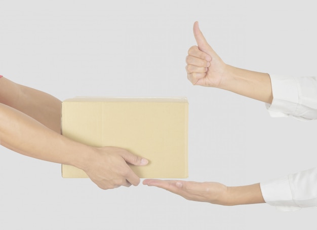 Woman receiving a package from the courier.