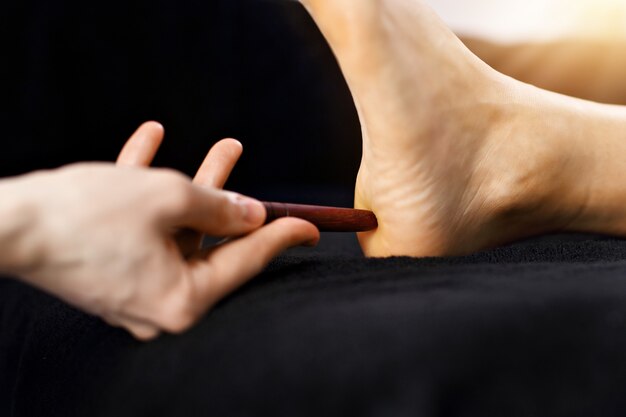 Woman receiving a thai foot massage at the health spa