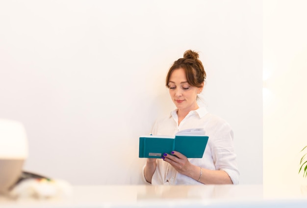 Woman Receptionist Reception Workplace Workplace in Beauty Salon White Interior