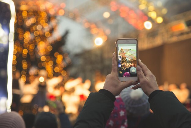 Woman record concert on her phone